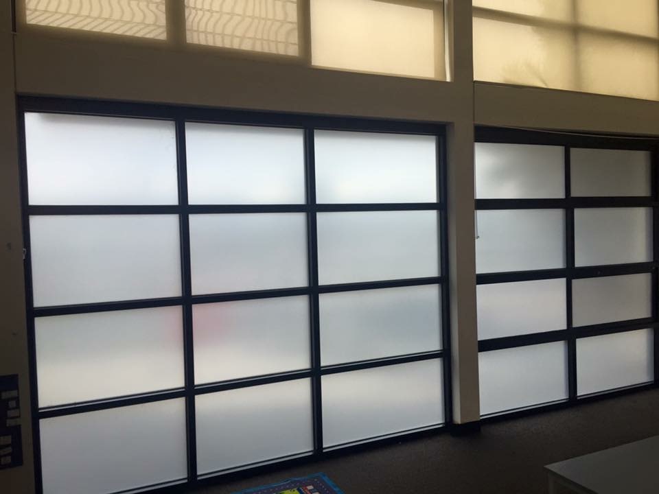 White frost finish within black framed window panels